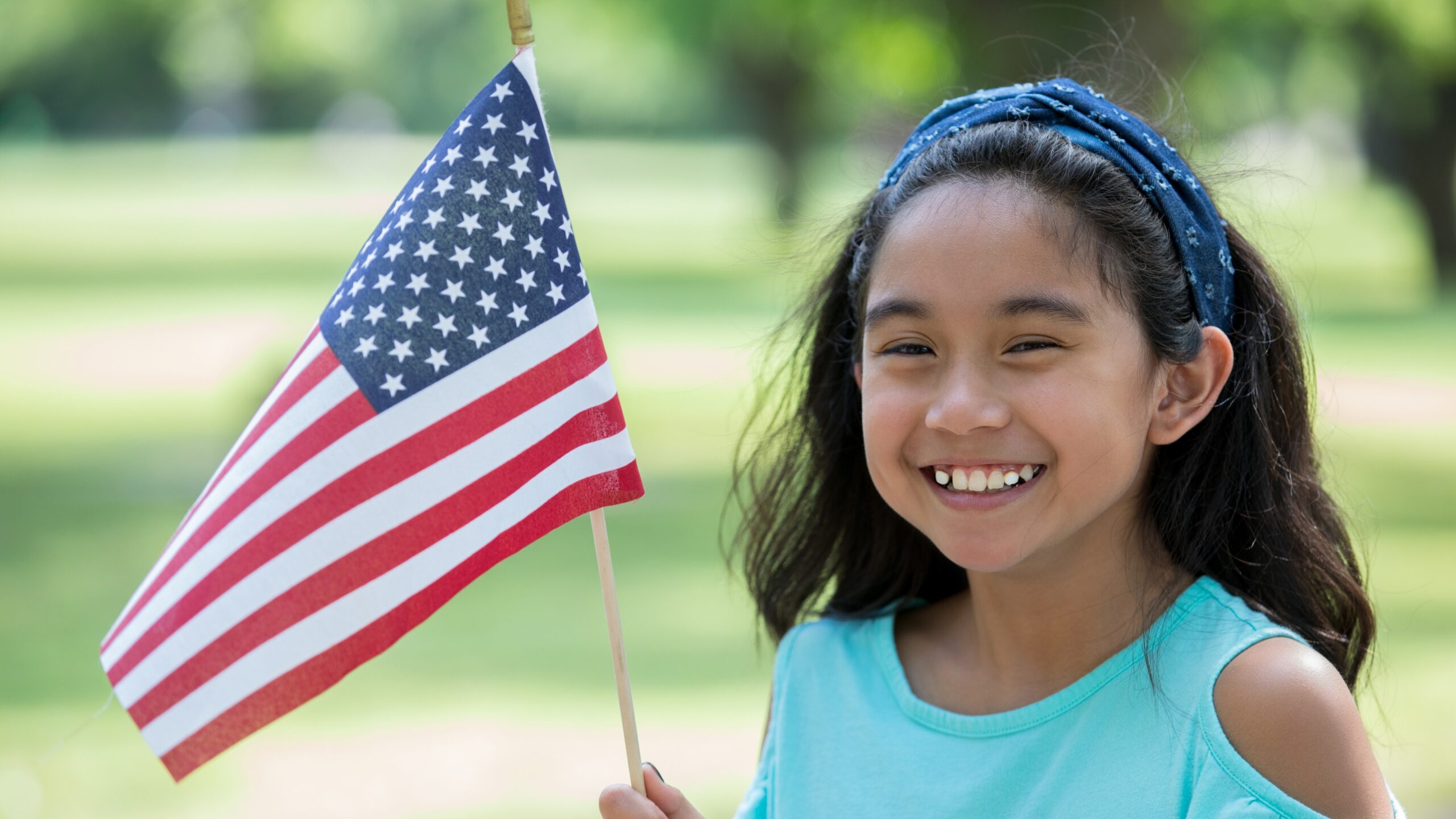 Little girl holding a flag