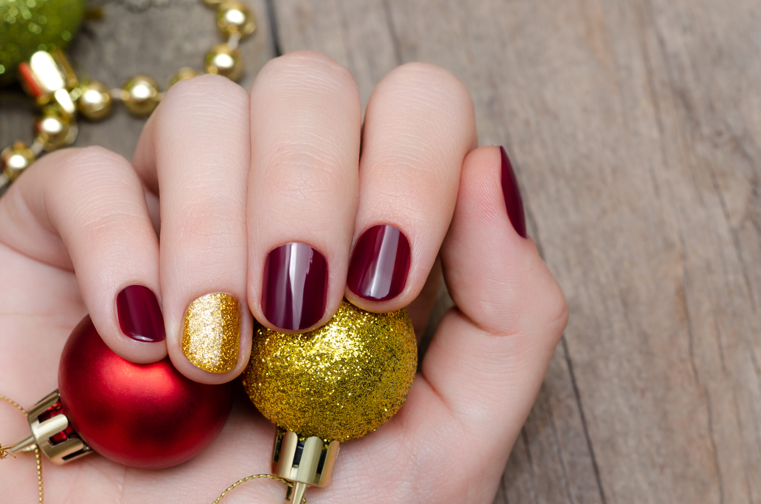 Beautiful female hand with christmas nail design