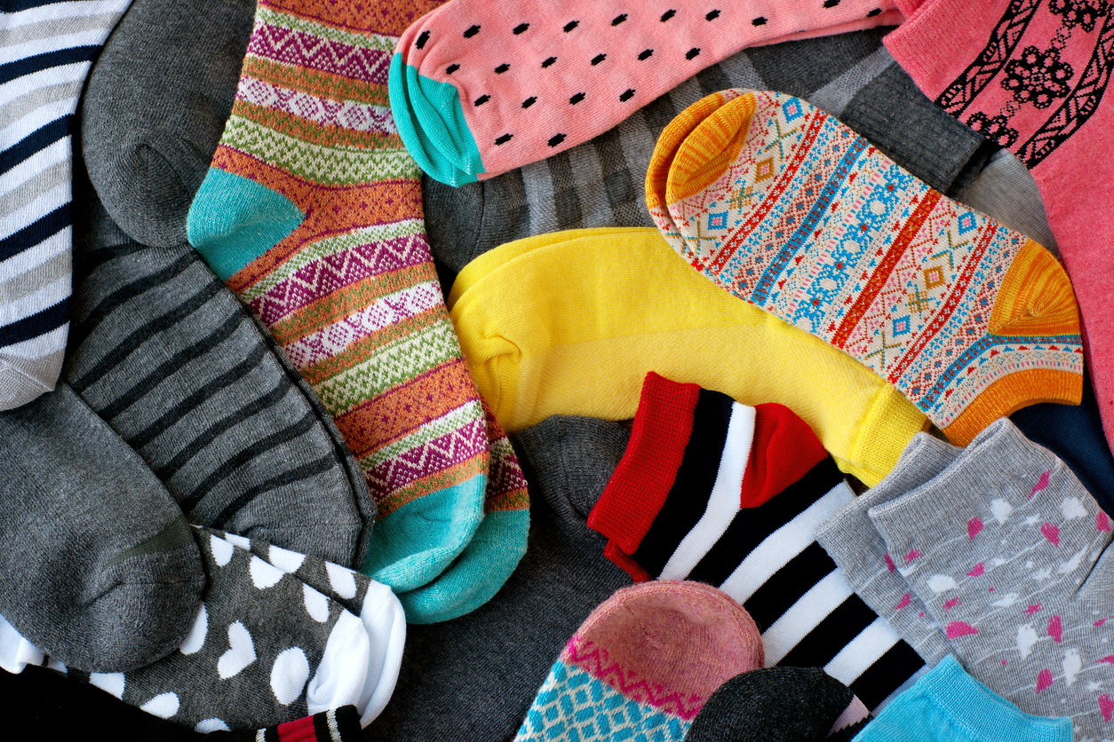 A pile of multi-colored socks. View from above.