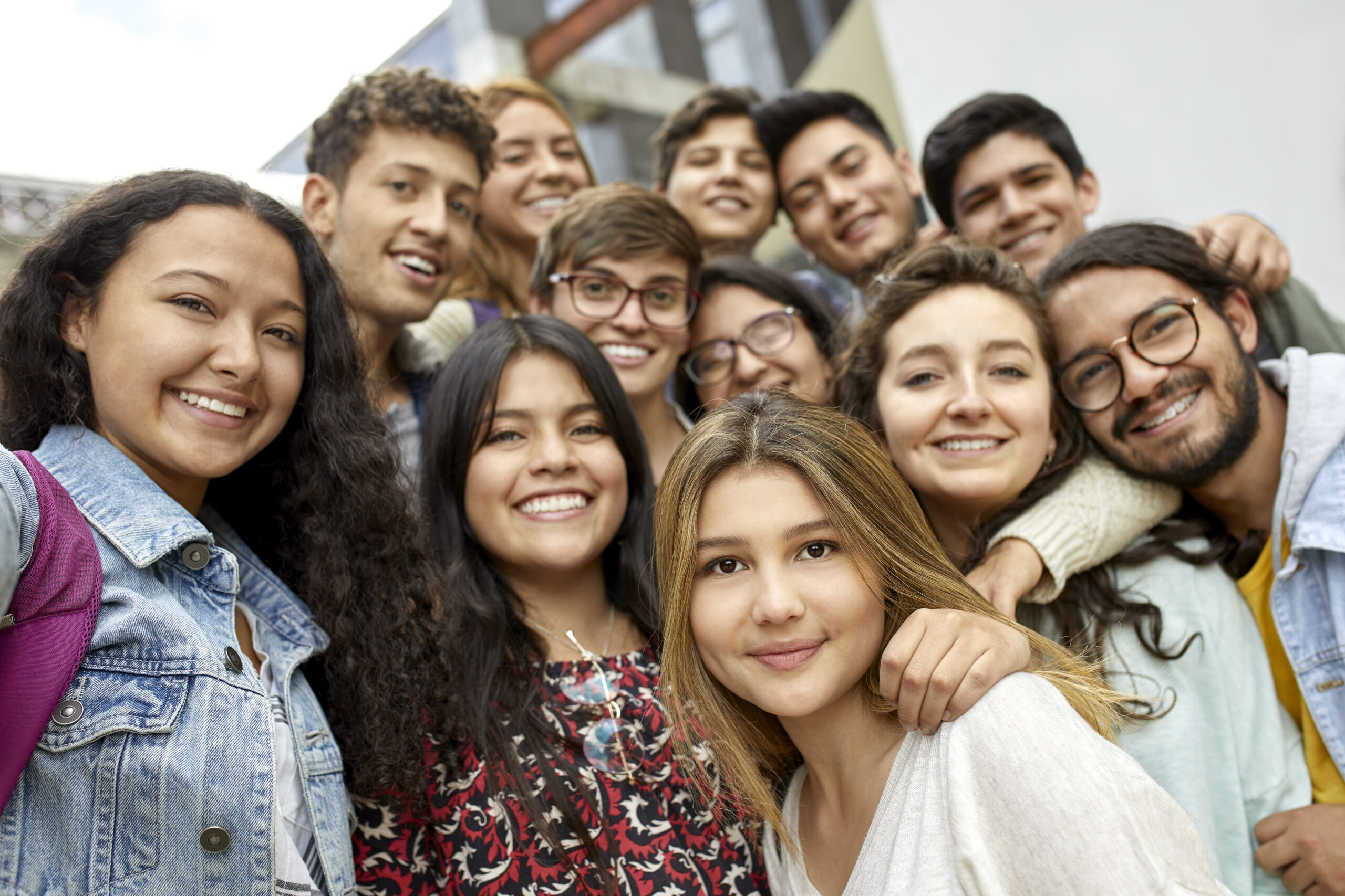 Smiling students standing in university campus