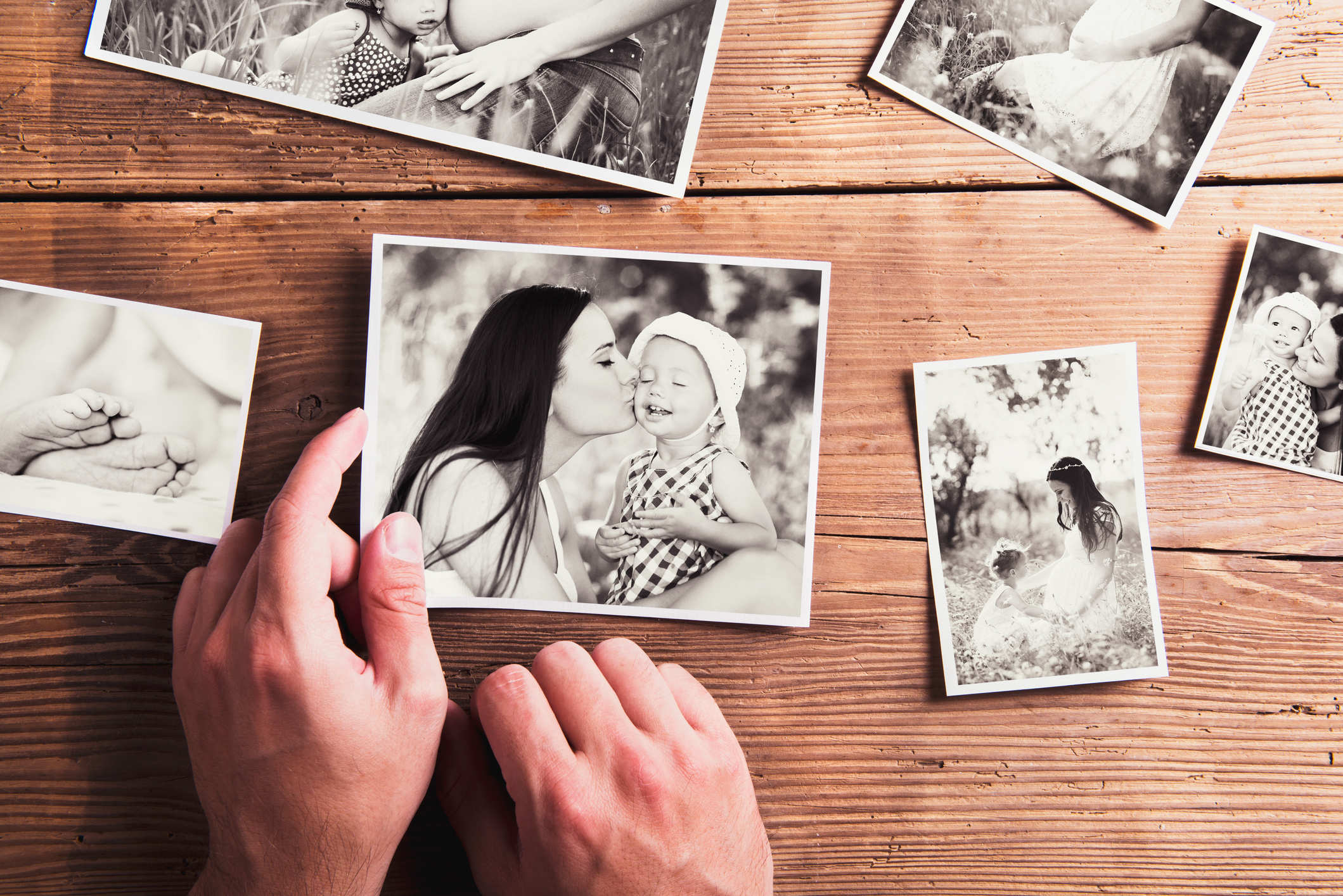 Mothers day composition. Black-and-white pictures, wooden backgr