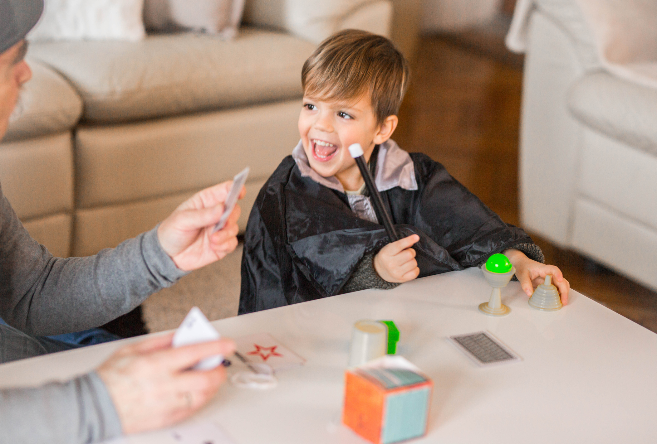 Grandfather playing magic with his grandson