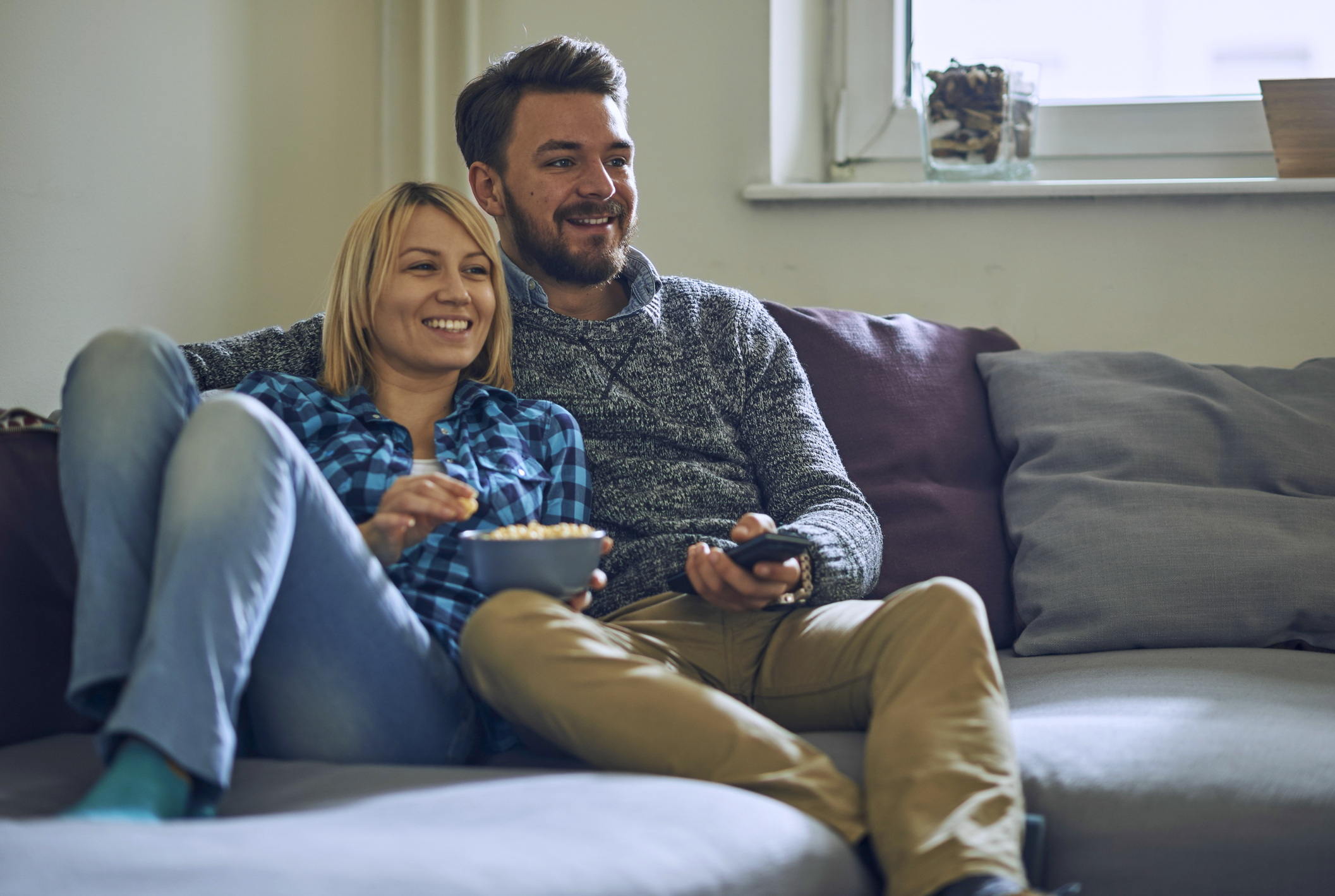 Couple at home watching TV