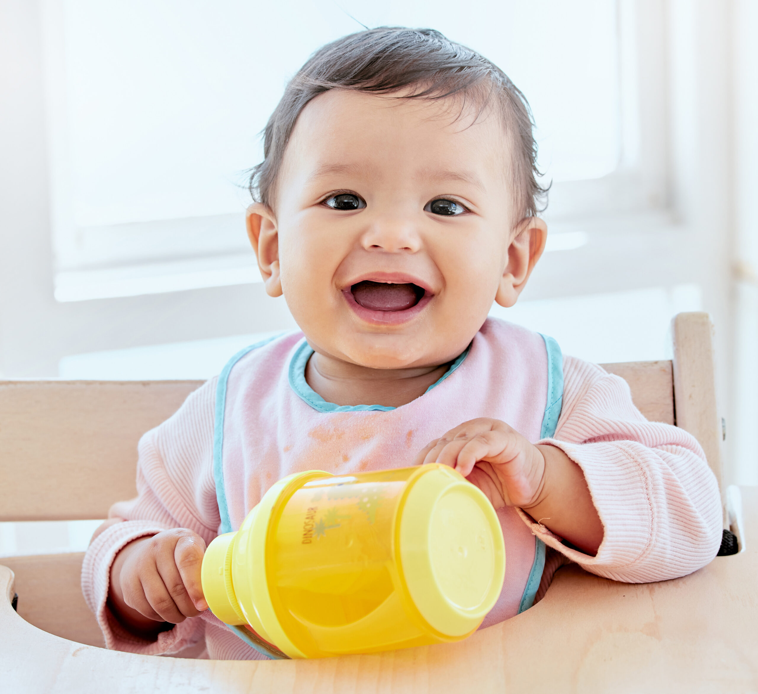 Shot of a sweet baby girl drinking a bottle at home