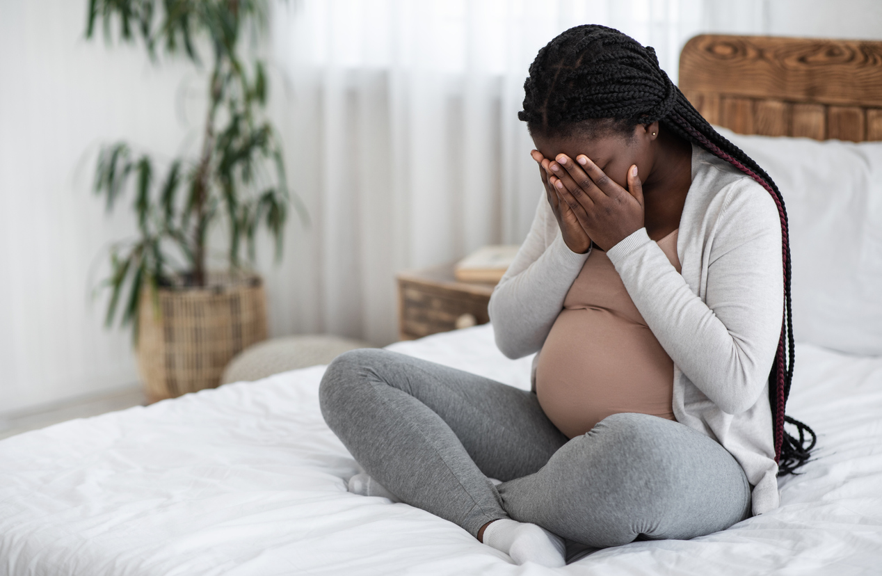 Sad Black Pregnant Woman Crying At Home, Having Maternity Depression