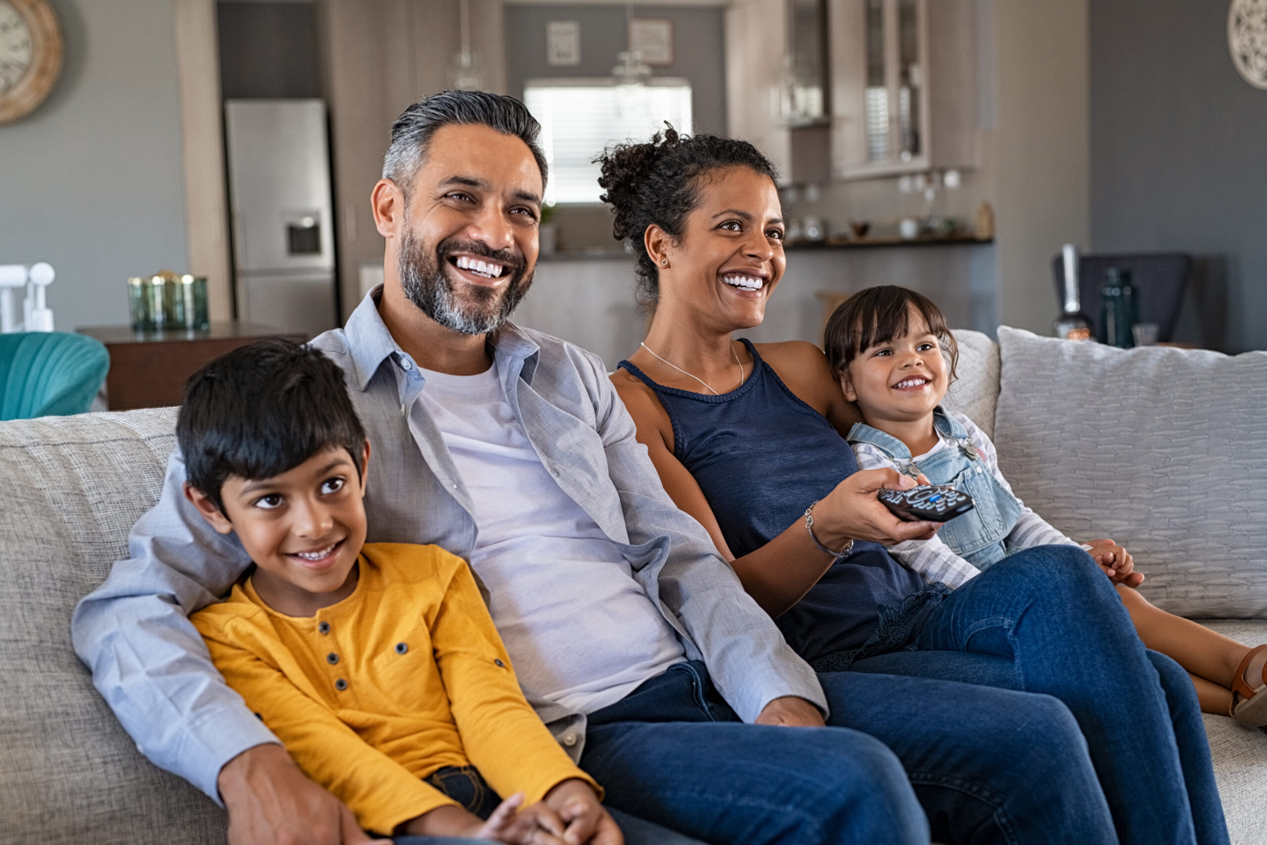 Family watching netflix series and movies on the sofa