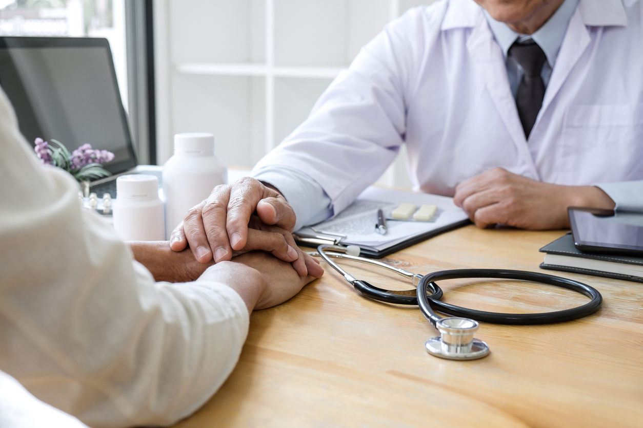 Professor doctor touching patient hand for encouragement and empathy on the hospital, cheering and support patient, Bad news, medical examination, trust and ethics