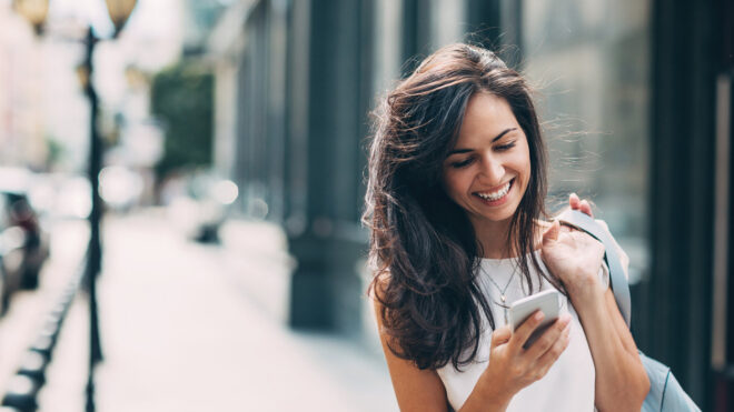 woman walking looking phone