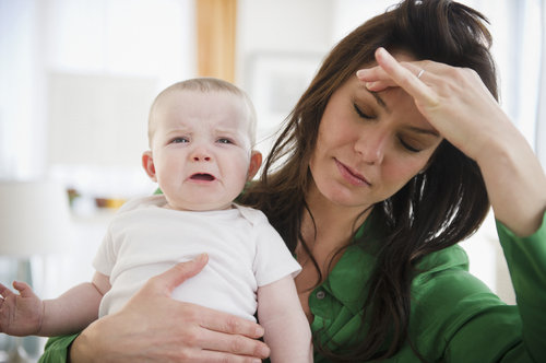 tired mom with baby