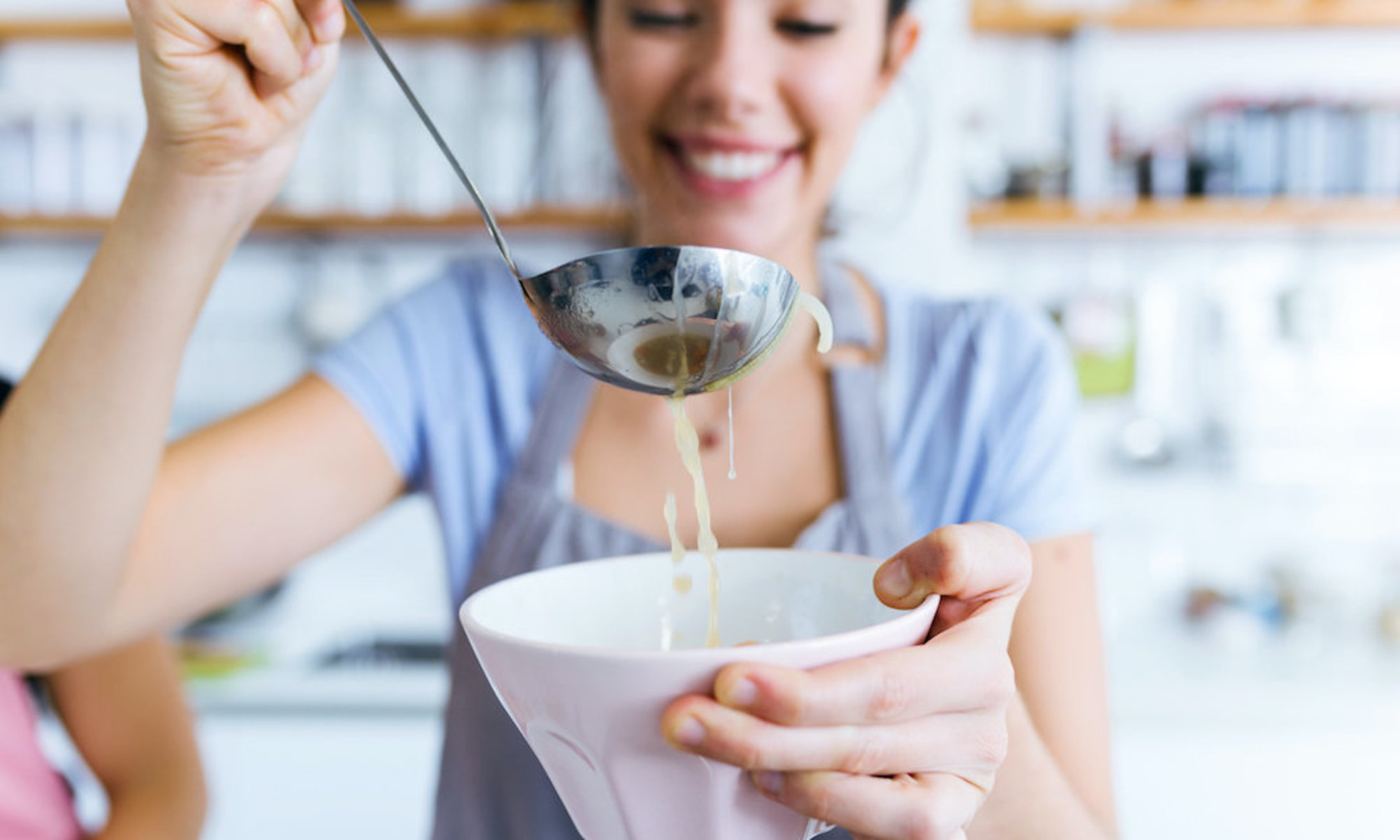 woman serving soup