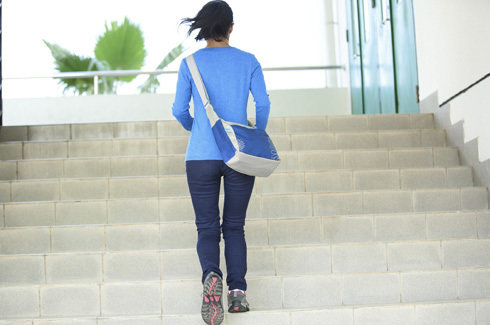 woman running up the stairs