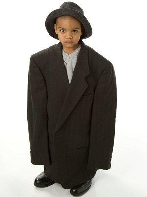 Boy in too large suit