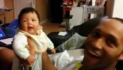 Daddy makes baby laugh