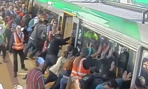 people save man trapped by train