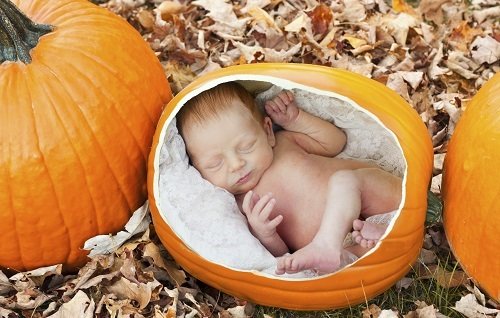 baby in pumpkin