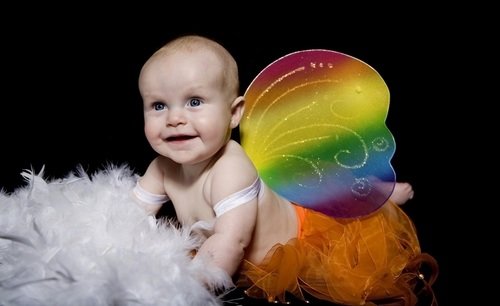 baby with rainbow wings