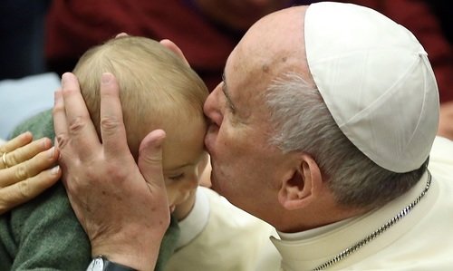 Pope Francis kissing baby