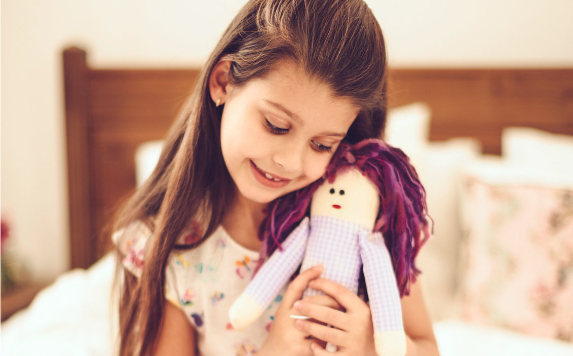 girl holding a doll