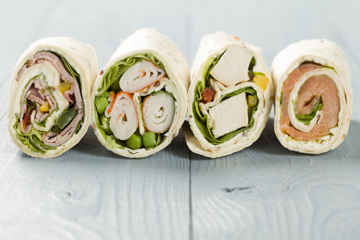 Mix of wraps with ham, chicken, salmon and crab served