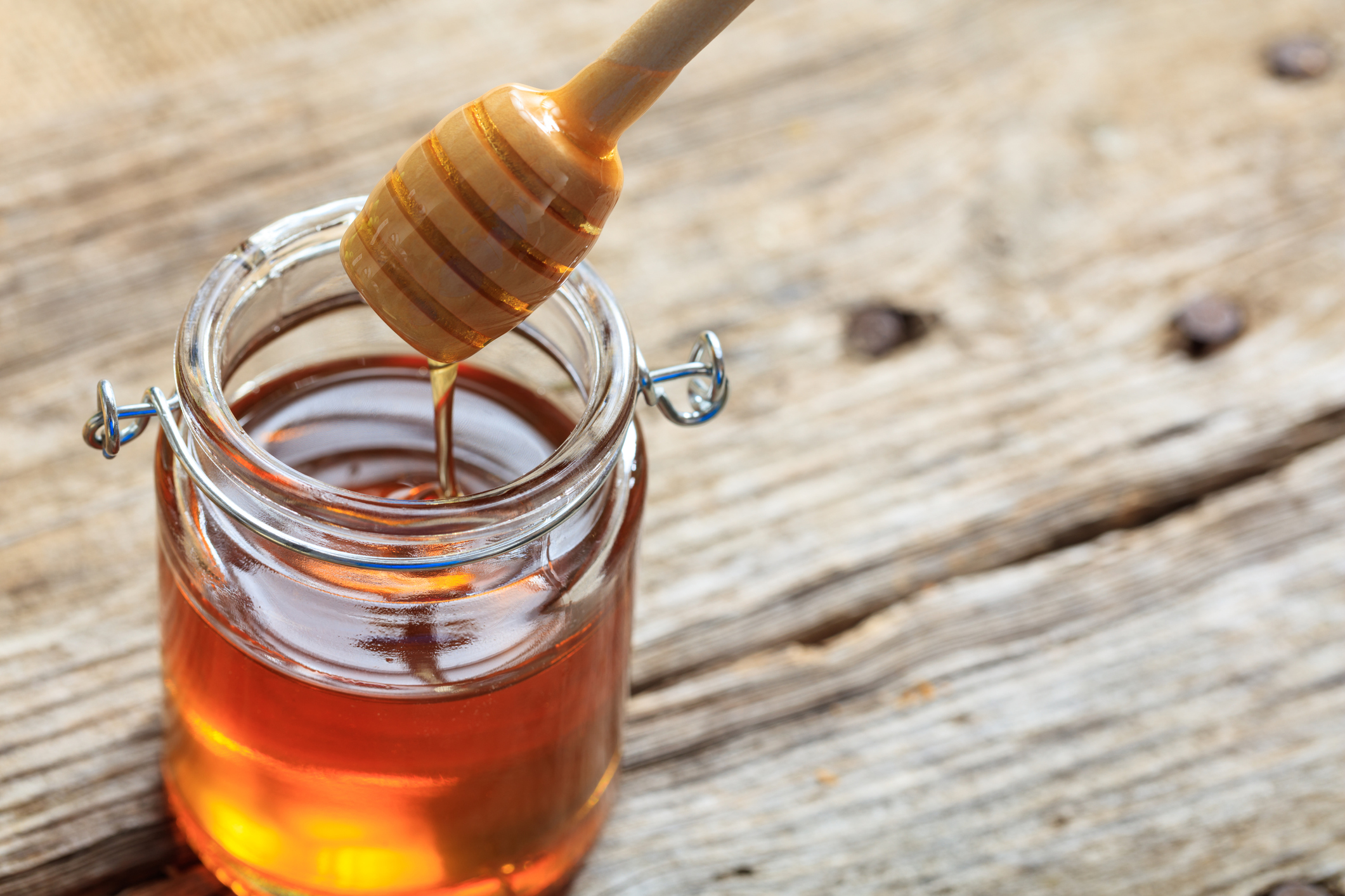 A glass jar with honey