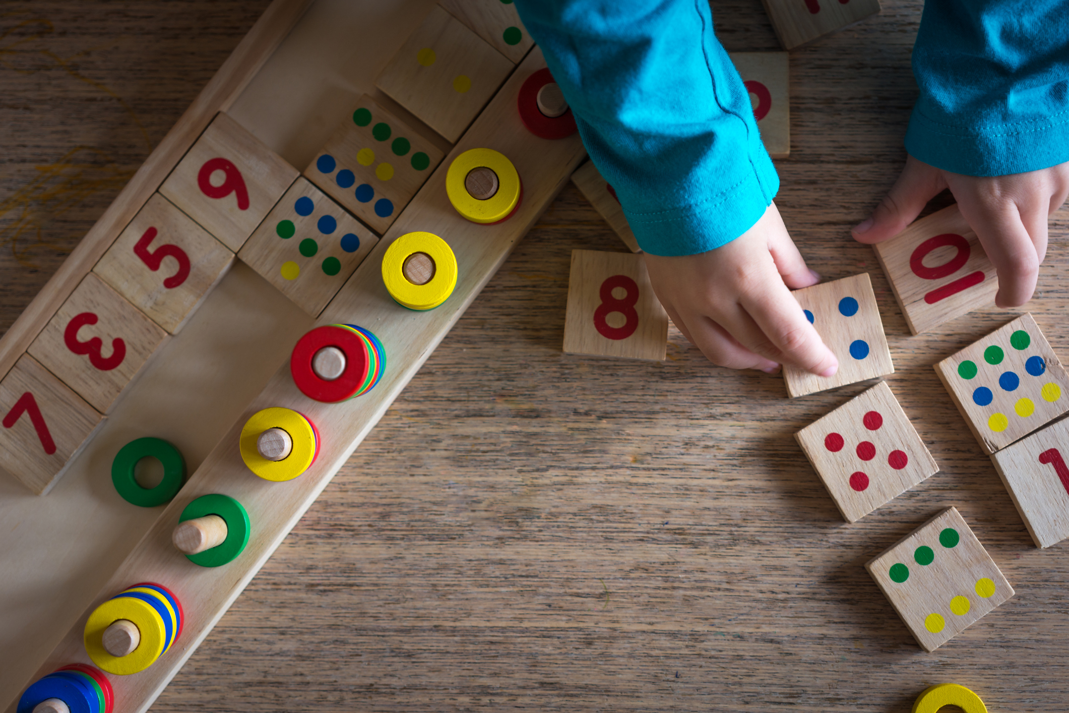 Child playing with mathematical toy