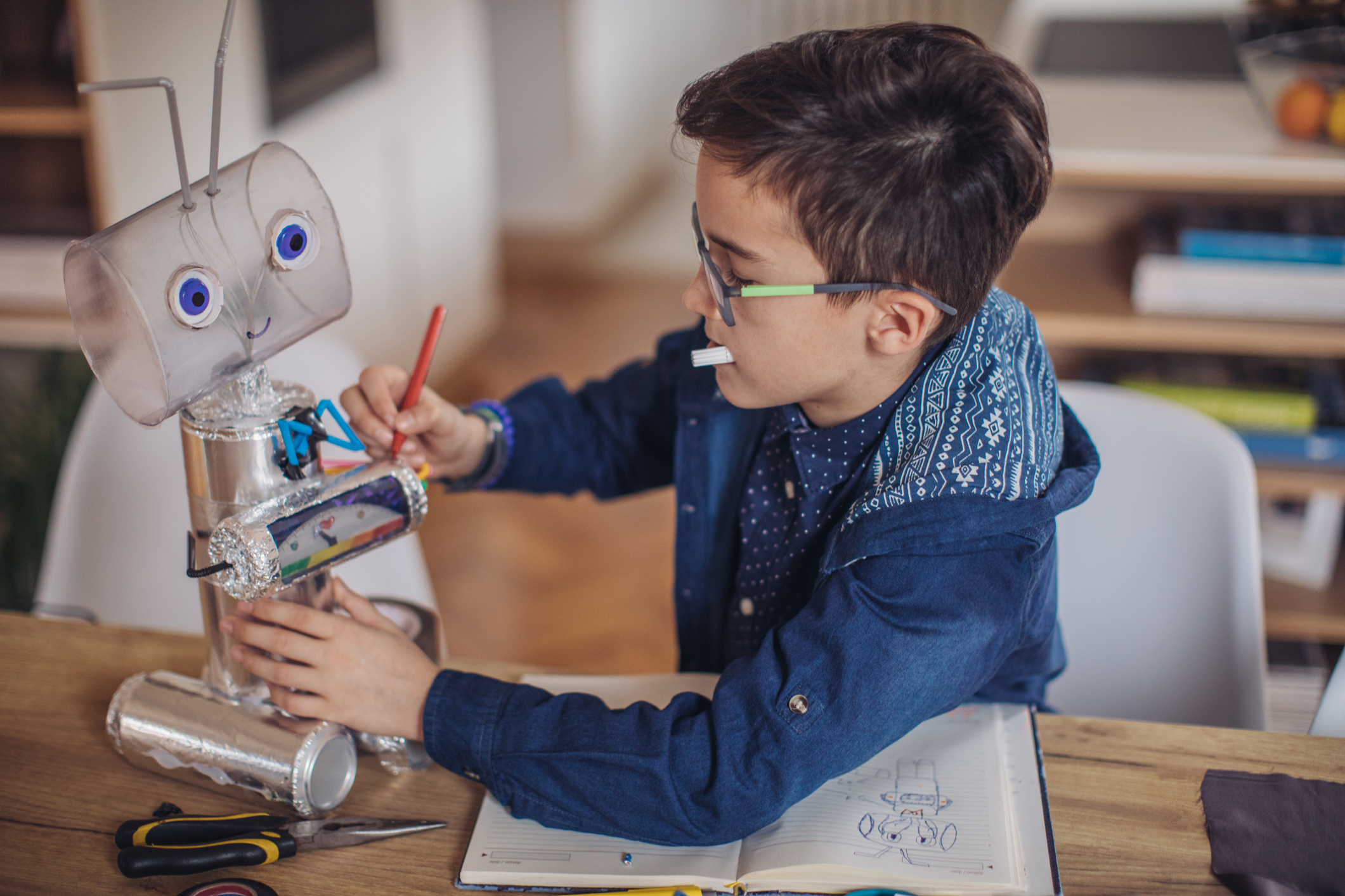 Boy making robot for school project