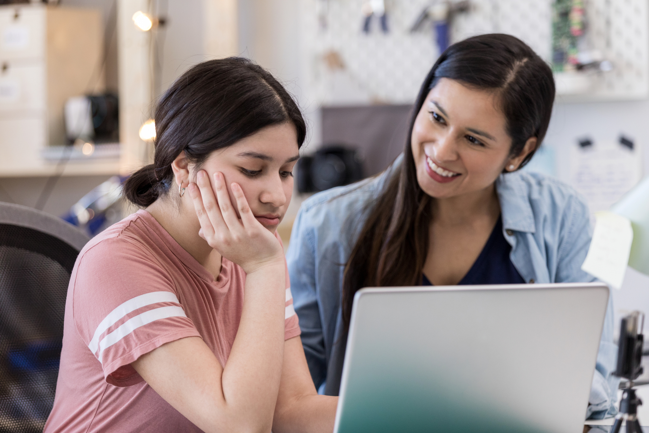 Frustrated teen ignores mother's encouragement