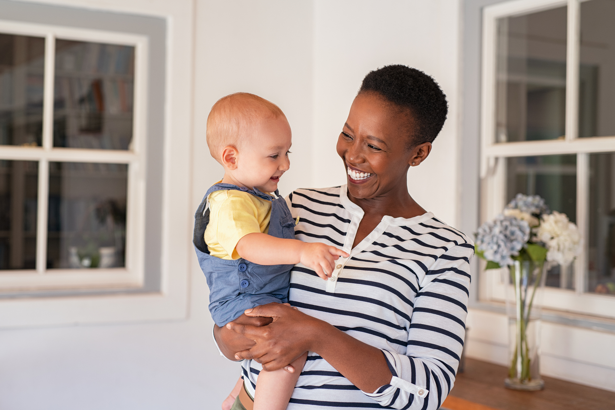 African mother holding adopted child