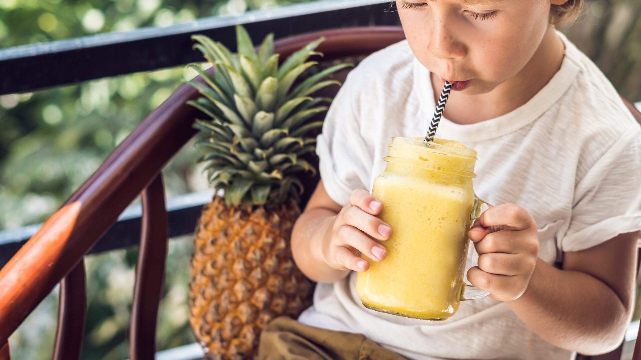 child drinking smoothie