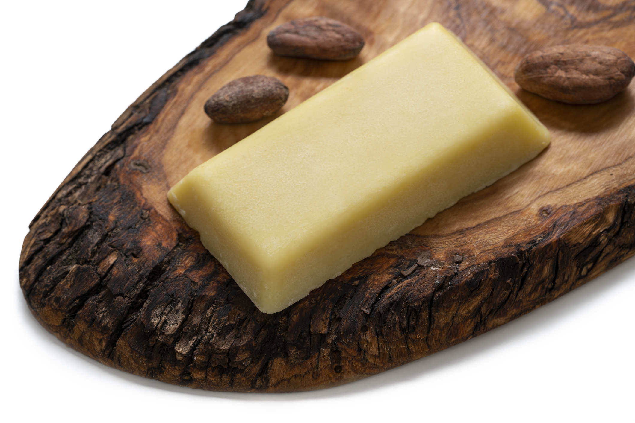 cocoa butter bar with cocoa nuts cacao on white background