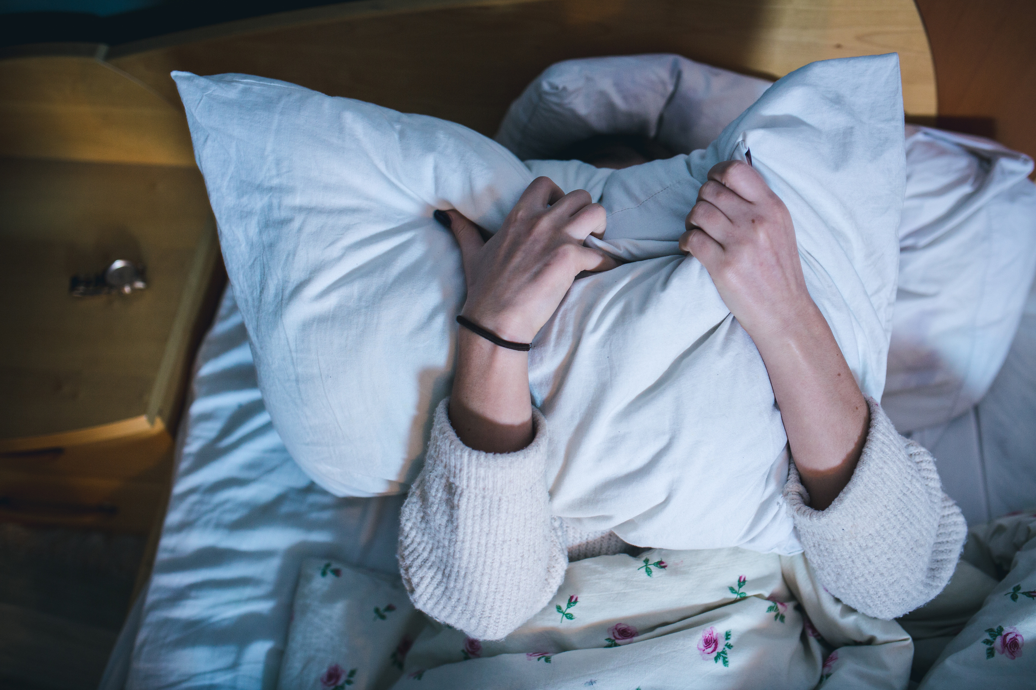 Portrait of depressed woman in bed