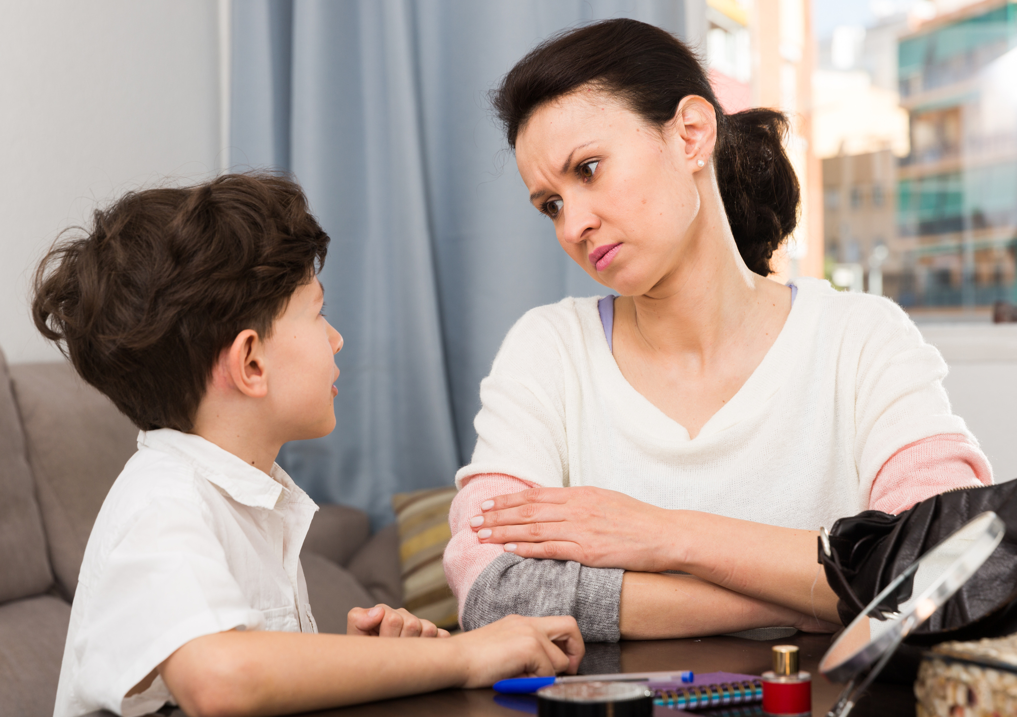 Serious woman talking with son