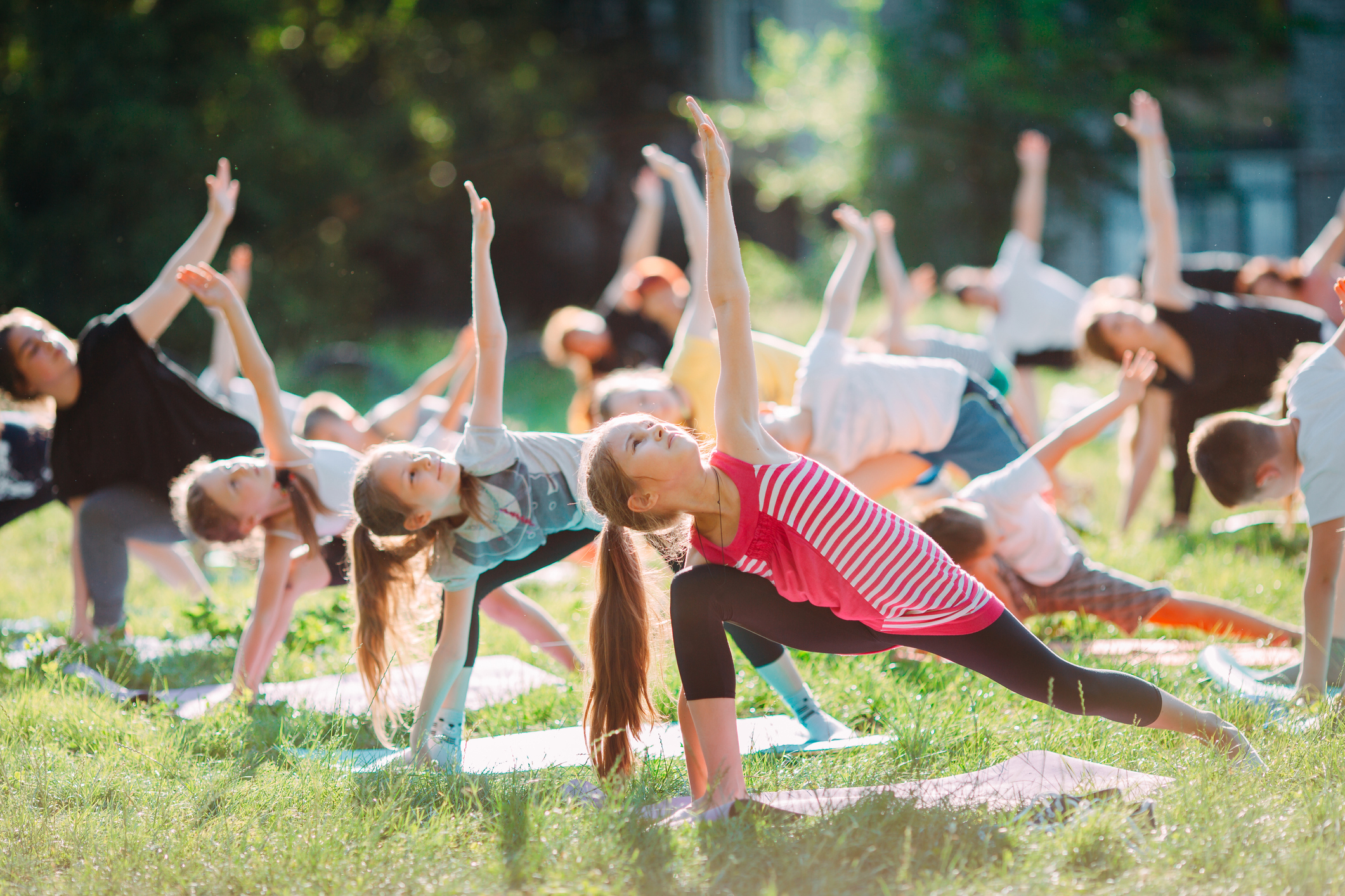 Yoga classes outside on the open air. Kids Yoga,