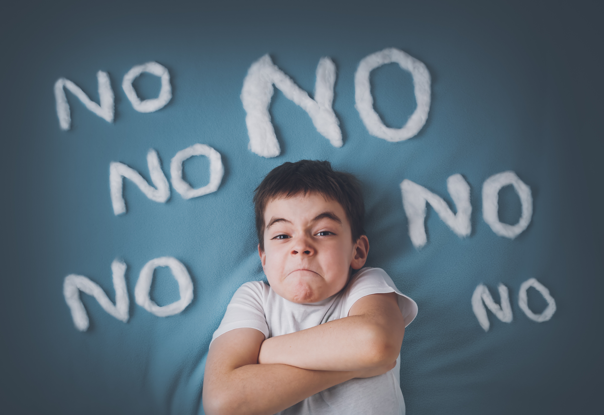 Bad boy on blue blanket background