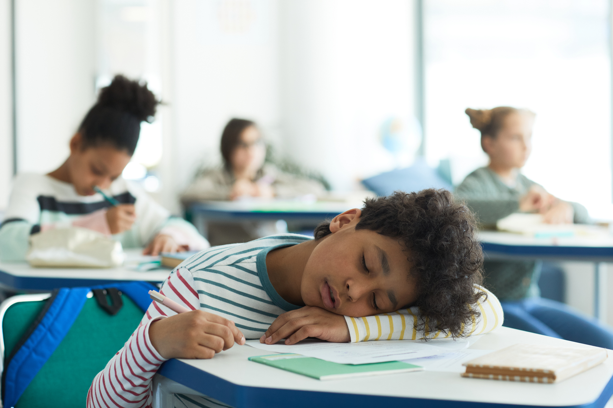 Boy Sleeping in School