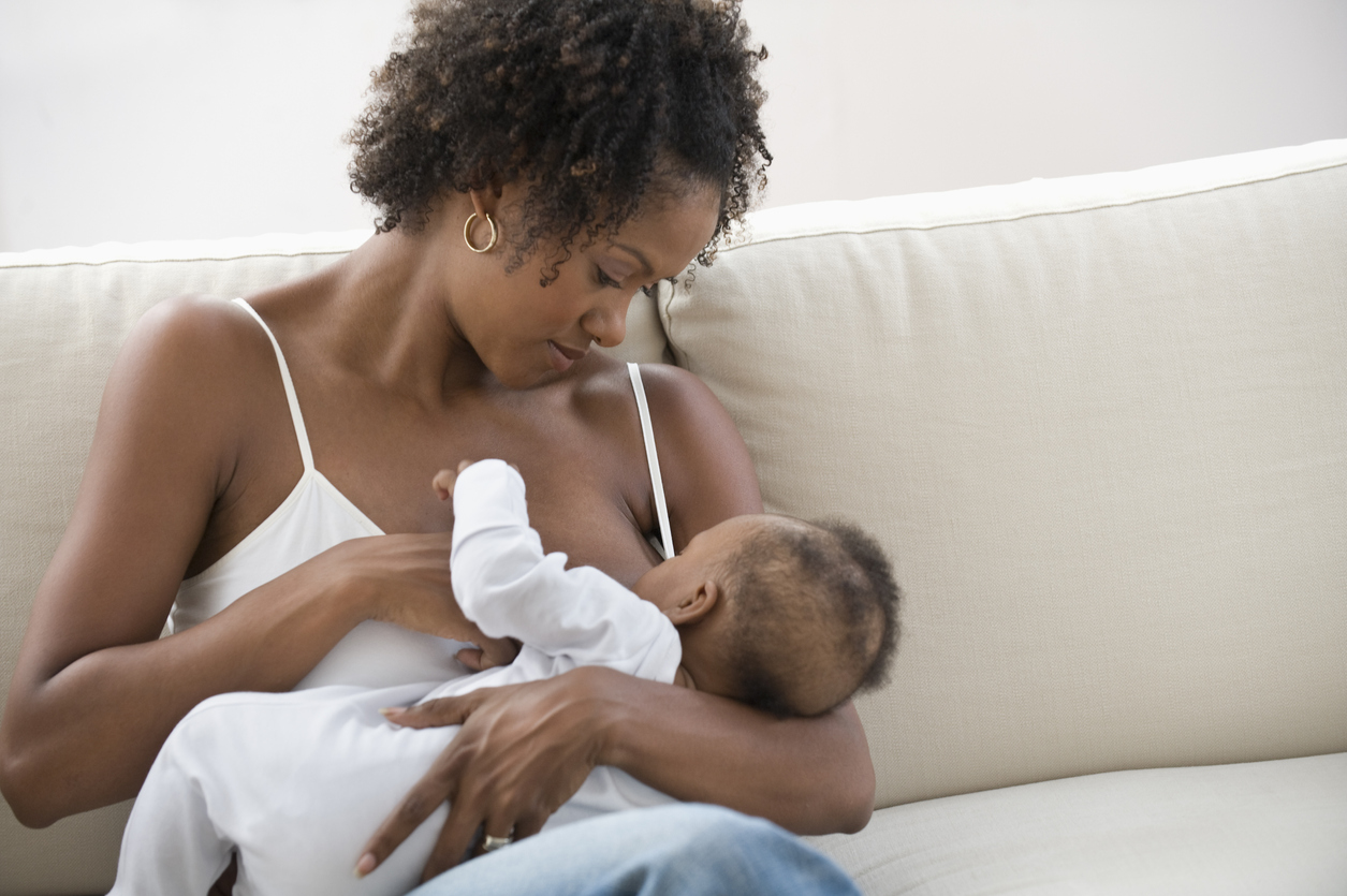 Mother nursing son