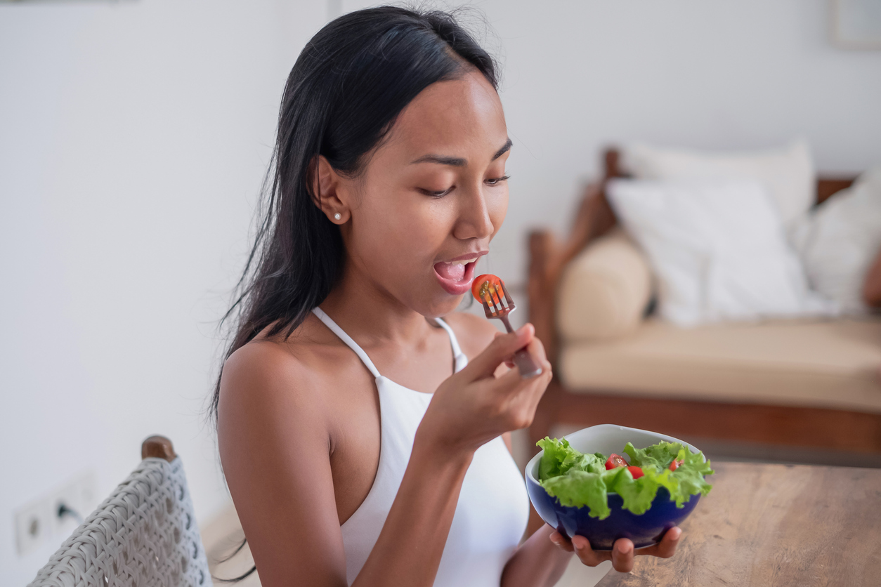 Southeast Asian Woman Eating Salad for Lunch