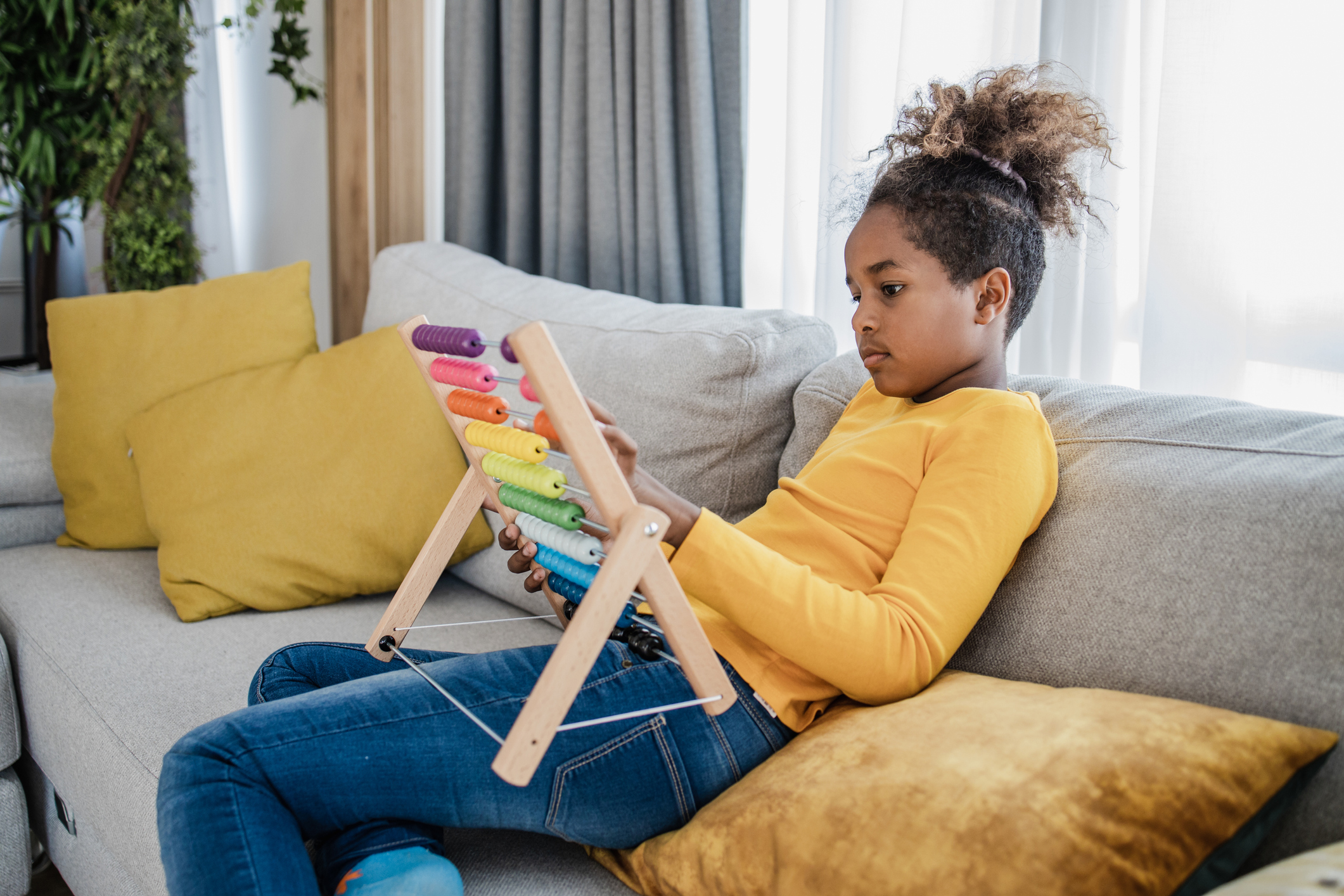 Portrait of a girl playing with abacus