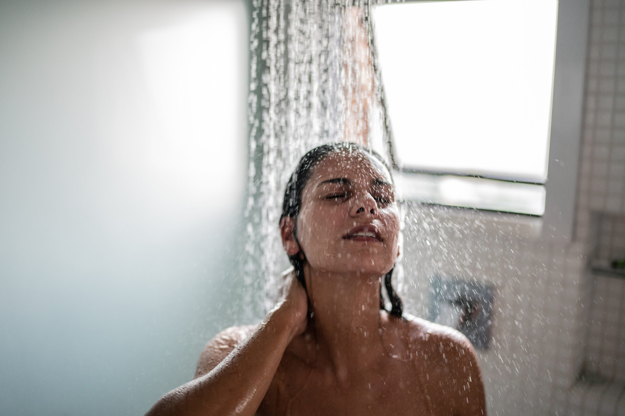 Woman taking a shower at home