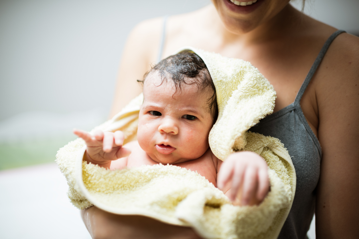 Mother cleaning a baby after bath