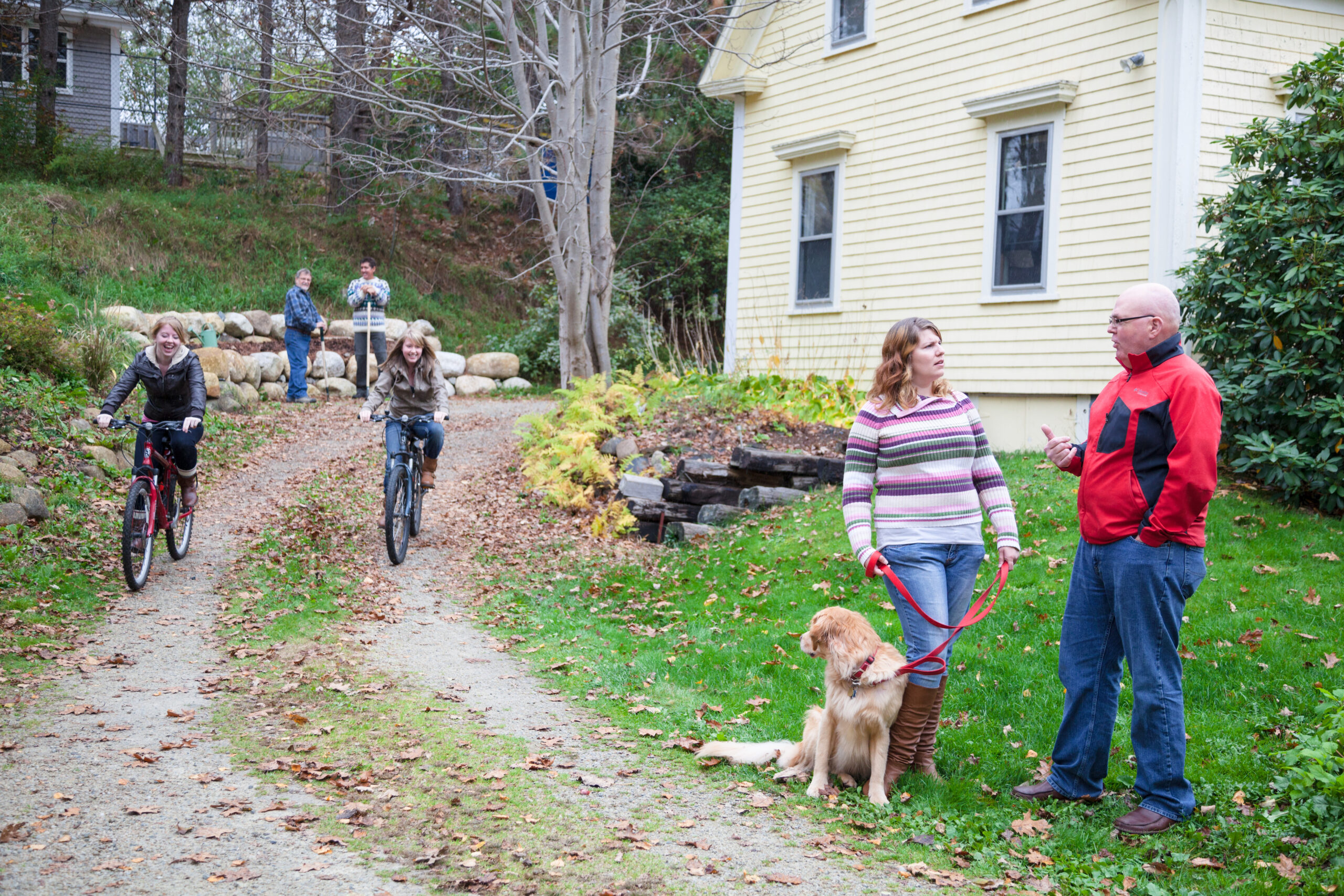 neighborhood scene teenage cycling family autumn