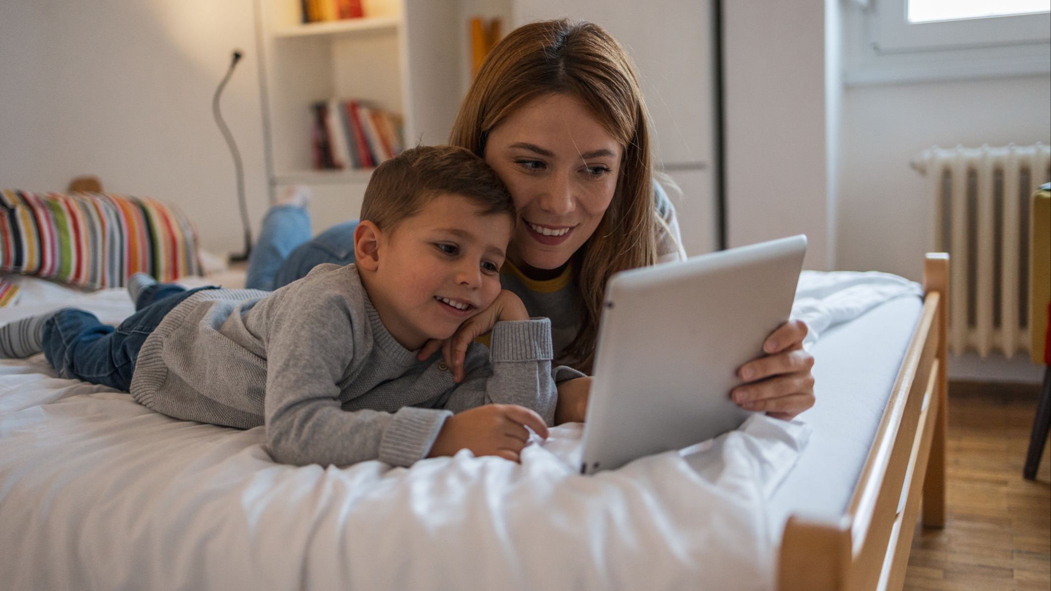 mom and daughter using tablet