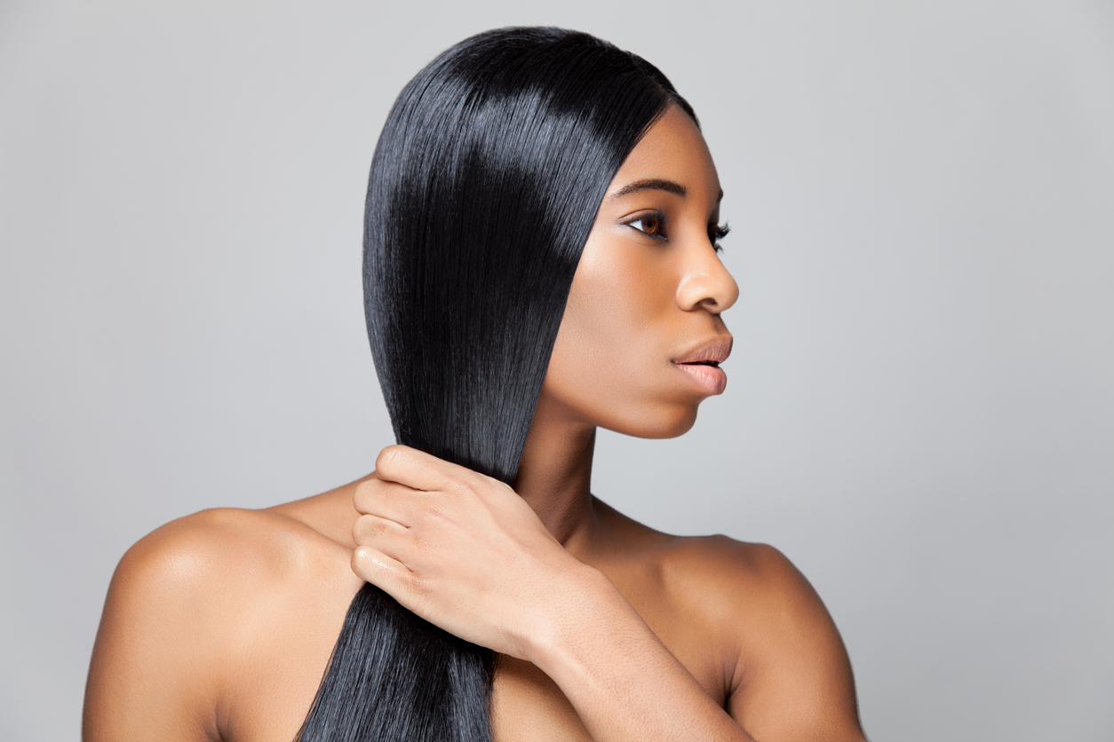 Profile picture of woman with black straight hair