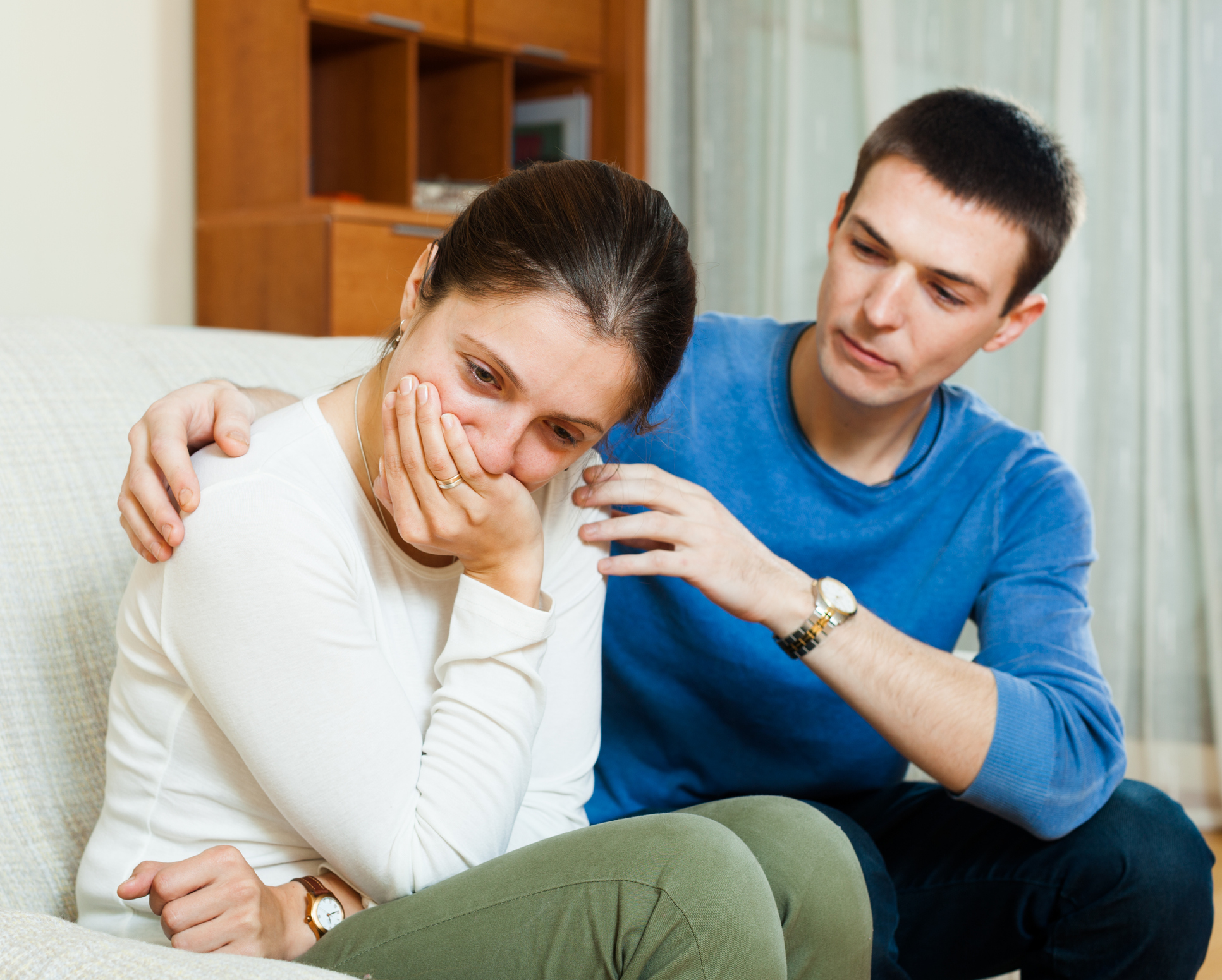 crying woman, man consoling her