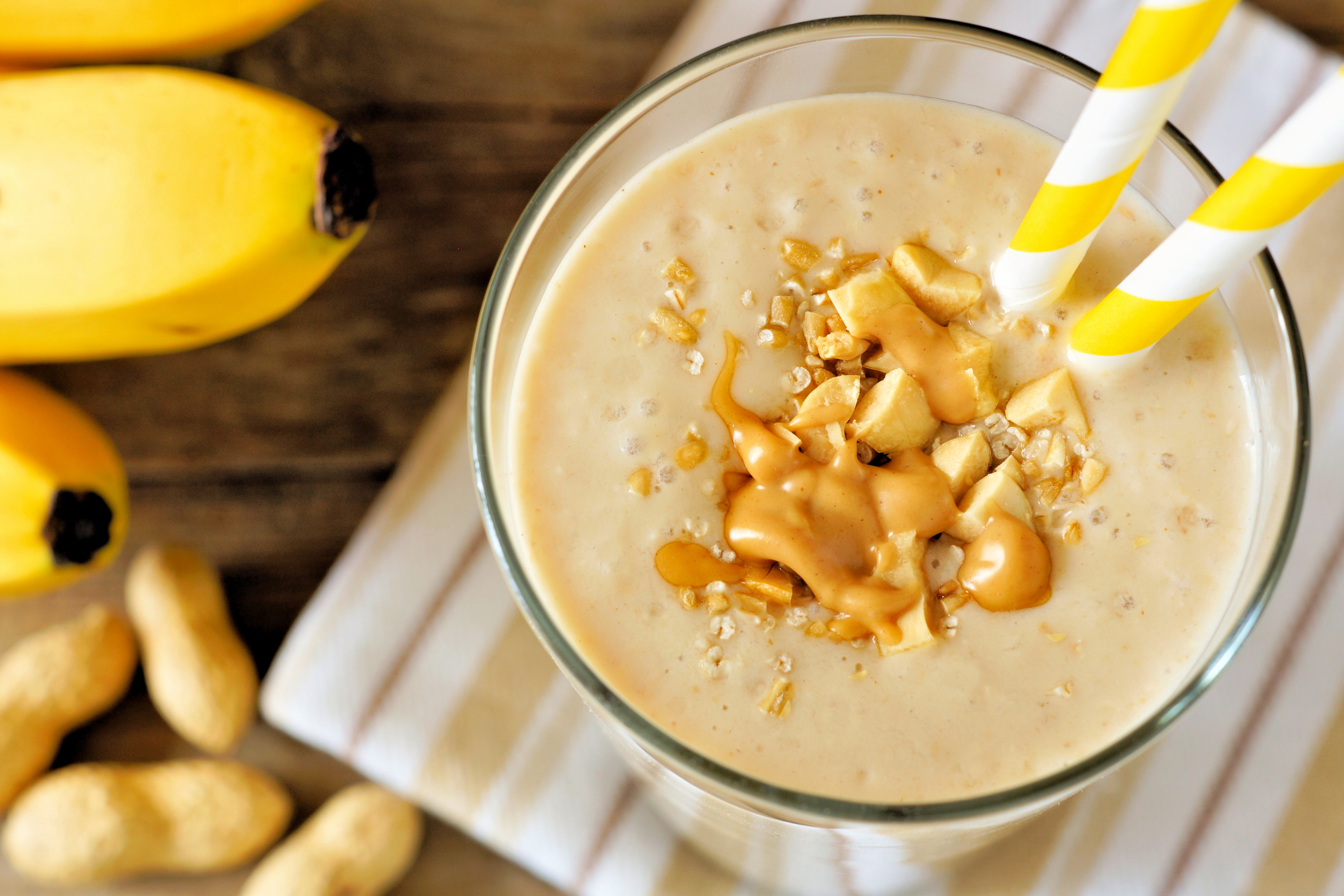 Peanut-butter banana oat smoothie close up, downward view