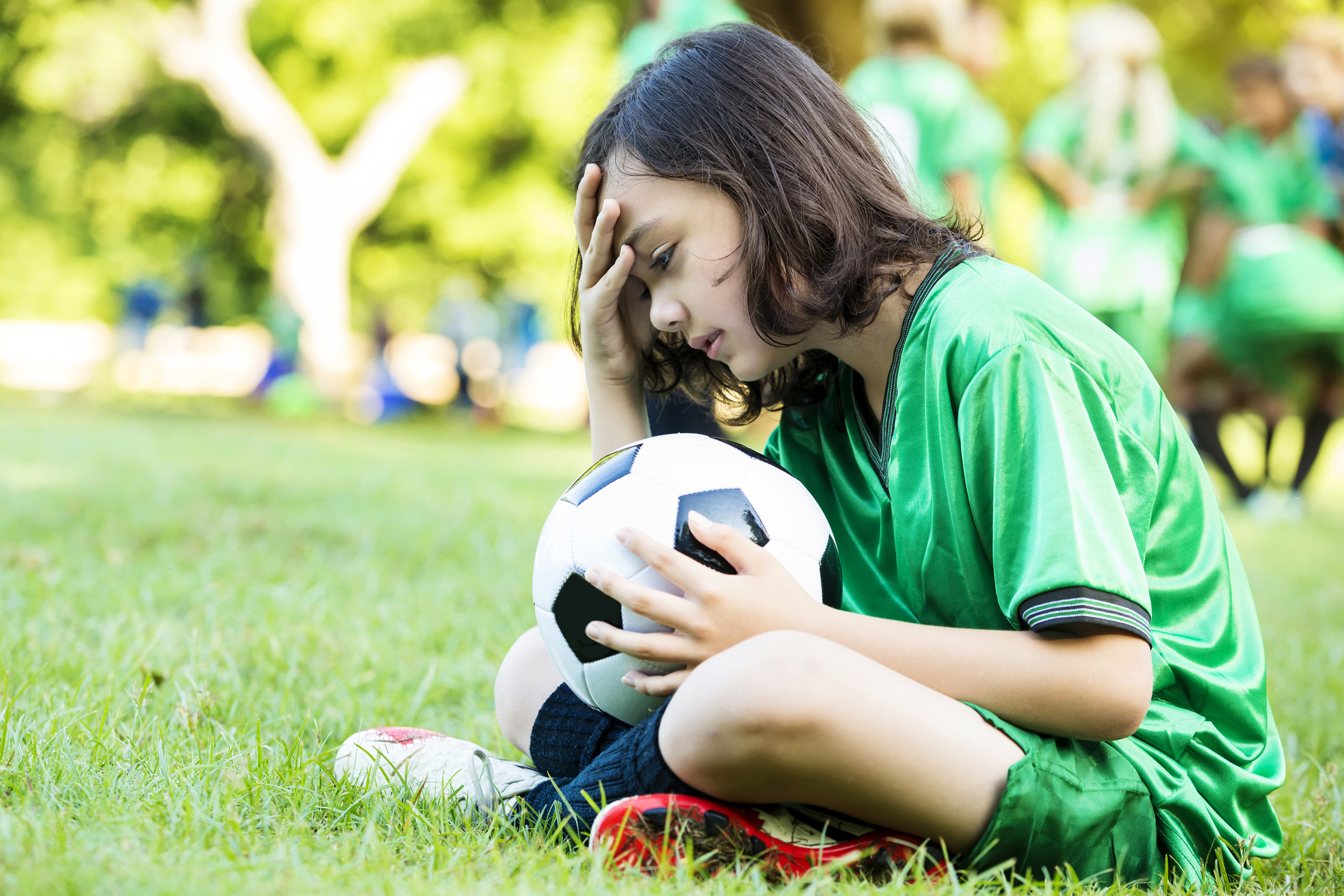 Upset soccer player after game loss