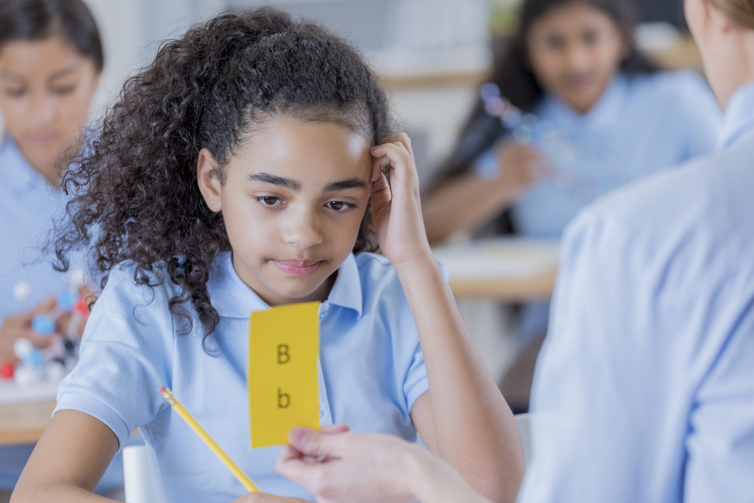 Teacher uses flashcards while working with student