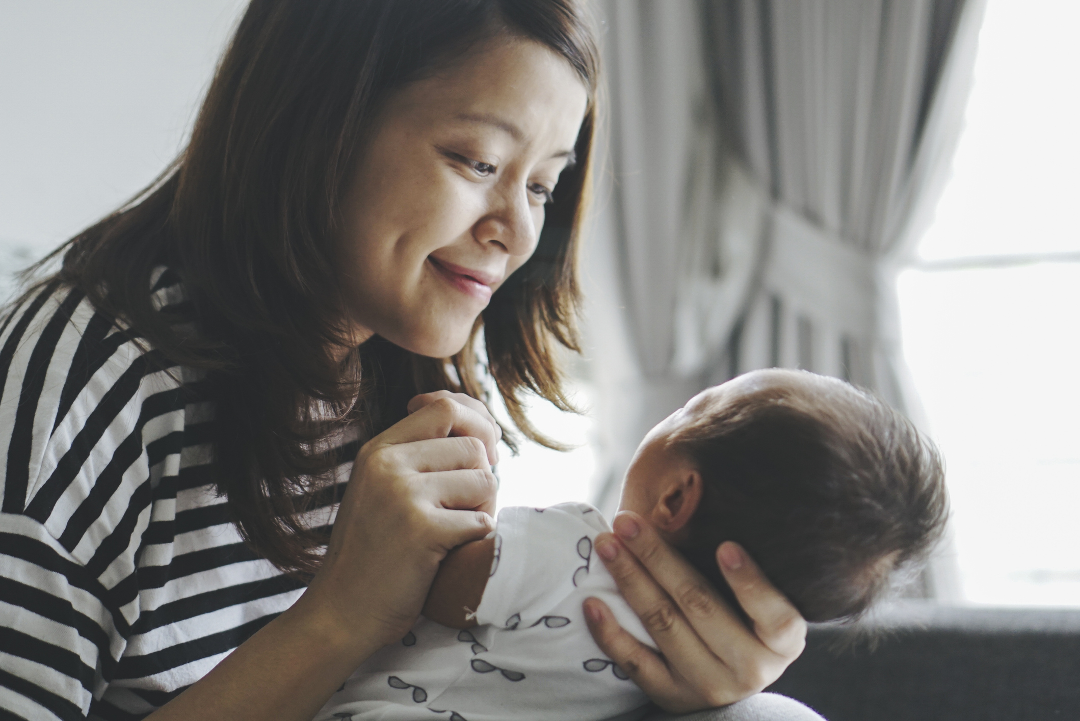 Mother kissing her child