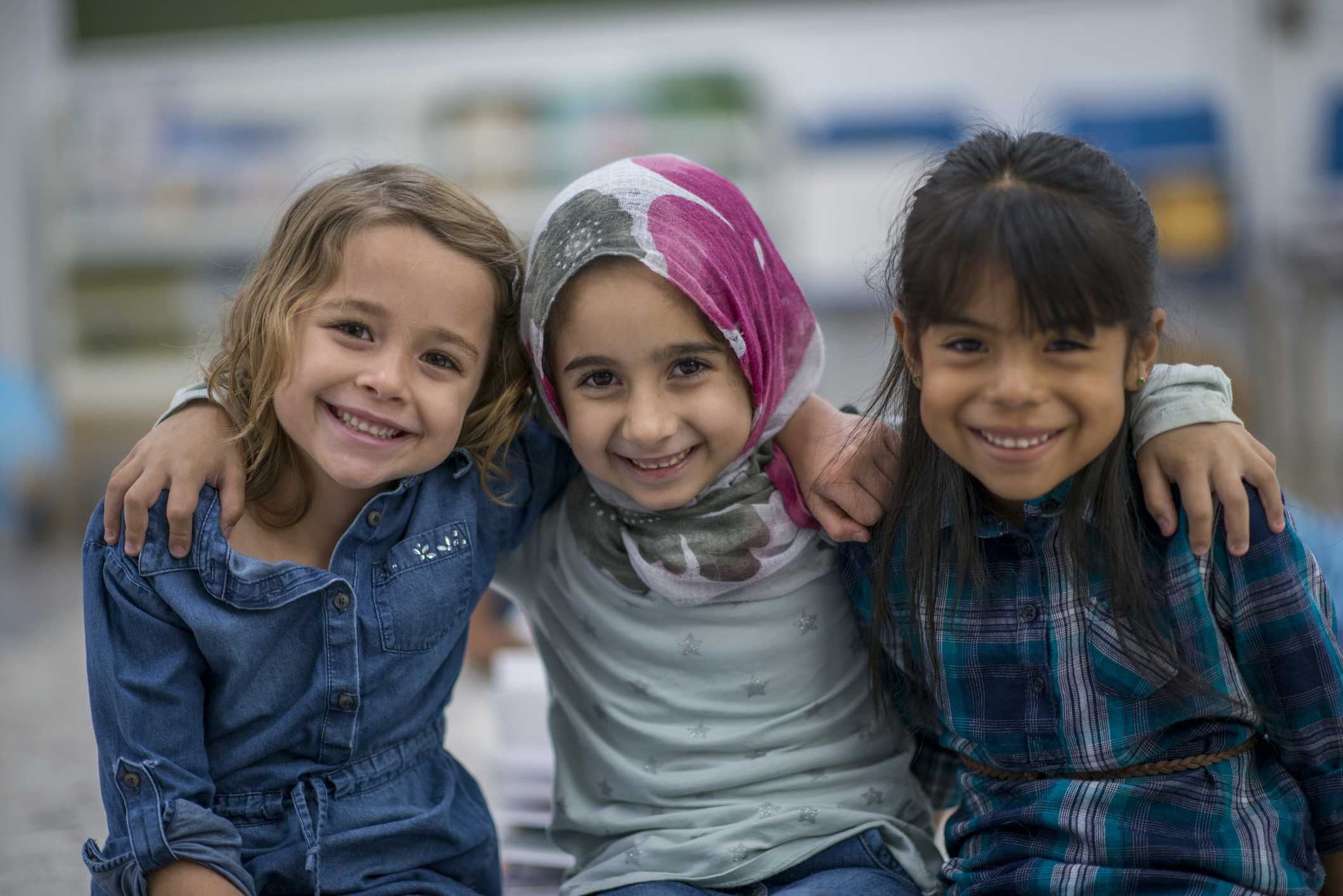 Little Muslim girl and her friends enjoy a day at school together.