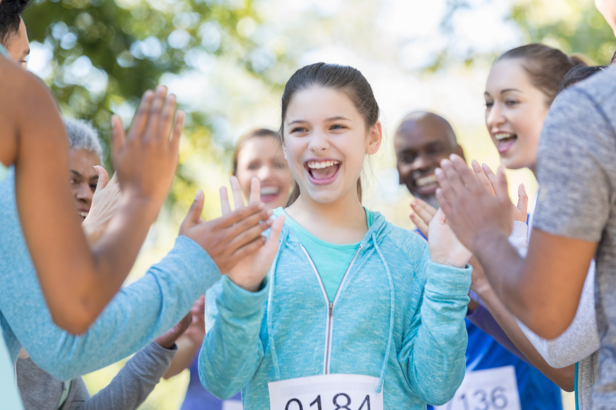 Preteen girl is all smiles as she finishes a charity race